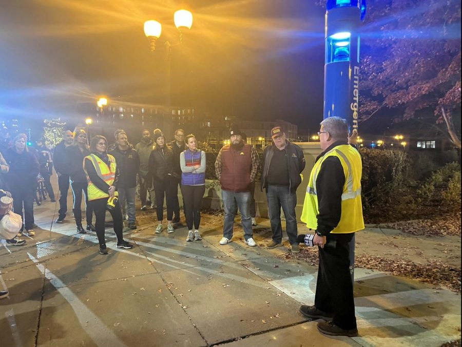 Nick Juarez talked about the emergency blue light kiosks on campus during the safety walk. About 35 people attended the walk. 