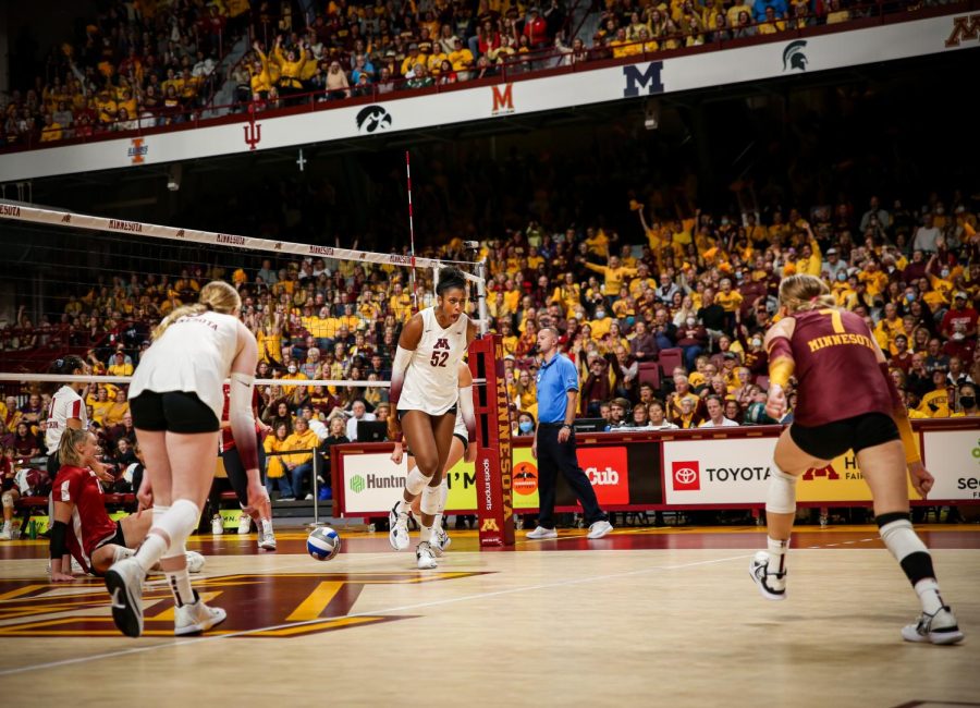 Middle blocker Carter Booth celebrates a point during the Gophers game against Wisconsin, Sept. 25. 