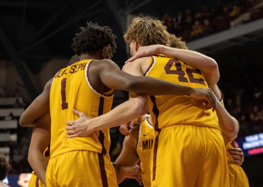 The team huddles between plays during their game against Indiana on Wednesday, Jan. 25.